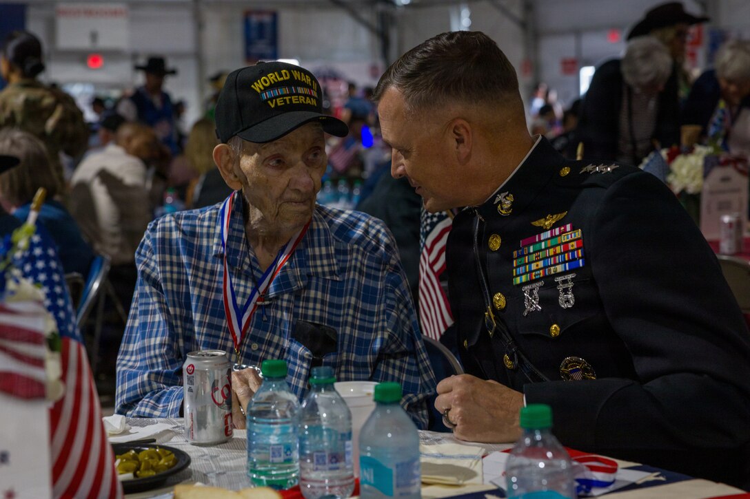 U.S. Marine Corps Lt. Gen. Leonard F. Anderson IV, commander of Marine Forces Reserve and Marine Forces South, talks U.S. Army Pvt Kenneth Robinson (Ret.), a WWII veteran and member of the “Greatest Generation,” at the Houston Livestock Show and Rodeo Armed Forces Appreciation Day in Houston, March 4, 2026. Armed Forces Appreciation Day honored nearly 4,000 military personnel and veterans, including a joint service enlistment ceremony for approximately 500 recruits. (U.S. Marine Corps photo by SSgt. Ethan M. LeBlanc)