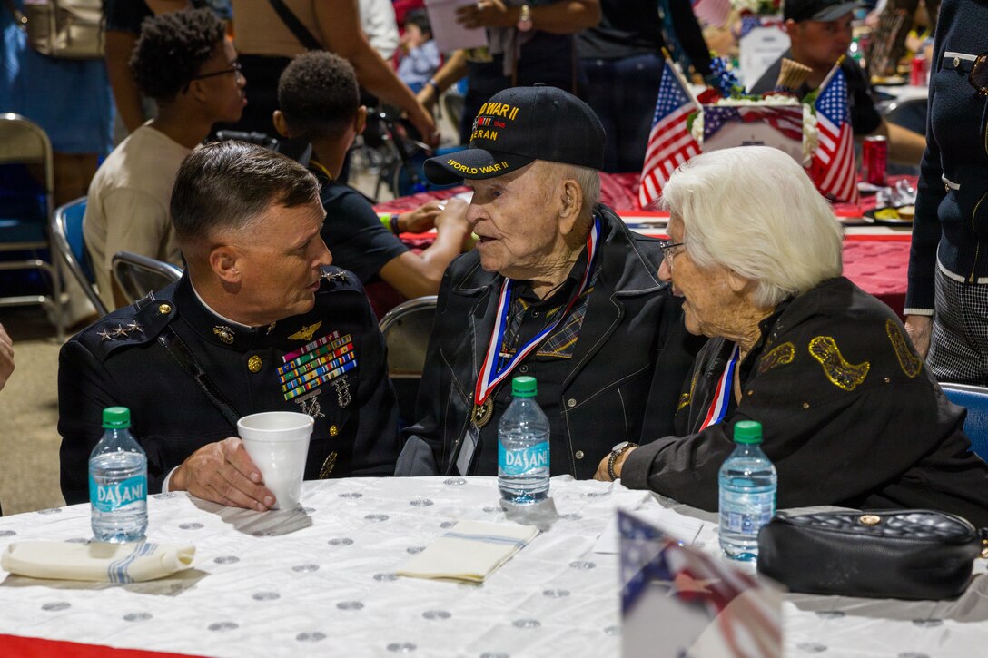 U.S. Marine Corps Lt. Gen. Leonard F. Anderson IV, commander of Marine Forces Reserve and Marine Forces South, talks with U.S. Army Pvt Chester “Buck” Sloan (Ret.), a WWII veteran, and U.S. Air Force veteran Shirley Sloan (Ret.), a Vietnam conflict veteran, members of the ”Greatest Generation” at the Houston Livestock Show and Rodeo Armed Forces Appreciation Day in Houston, March 4, 2026. Armed Forces Appreciation Day honored nearly 4,000 military personnel and veterans, including a joint service enlistment ceremony for approximately 500 recruits. (U.S. Marine Corps photo by SSgt. Ethan M. LeBlanc)