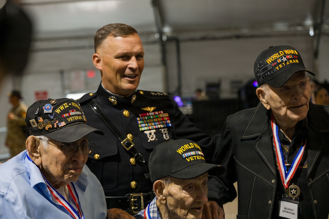 U.S. Marine Corps Lt. Gen. Leonard F. Anderson IV, commander of Marine Forces Reserve and Marine Forces South, poses for a photo with members of the “Greatest Generation” at the Houston Livestock Show and Rodeo Armed Forces Appreciation Day in Houston, March 4, 2026. Armed Forces Appreciation Day honored nearly 4,000 military personnel and veterans, including a joint service enlistment ceremony for approximately 500 recruits. (U.S. Marine Corps photo by SSgt. Ethan M. LeBlanc)