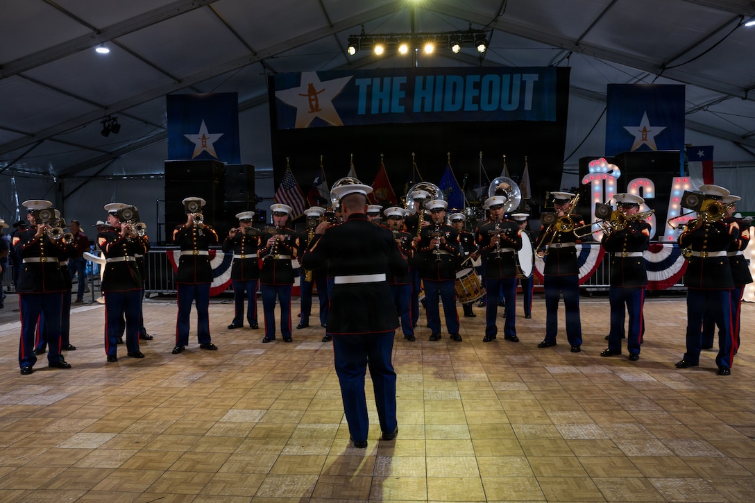 The U.S. Marine Forces Reserve band performs for servicemembers and veterans at the Houston Livestock Show and Rodeo Armed Forces Appreciation Day in Houston, March 4, 2026. Armed Forces Appreciation Day honored nearly 4,000 military personnel and veterans, including a joint service enlistment ceremony for approximately 500 recruits. (U.S. Marine Corps photo by SSgt. Ethan M. LeBlanc)