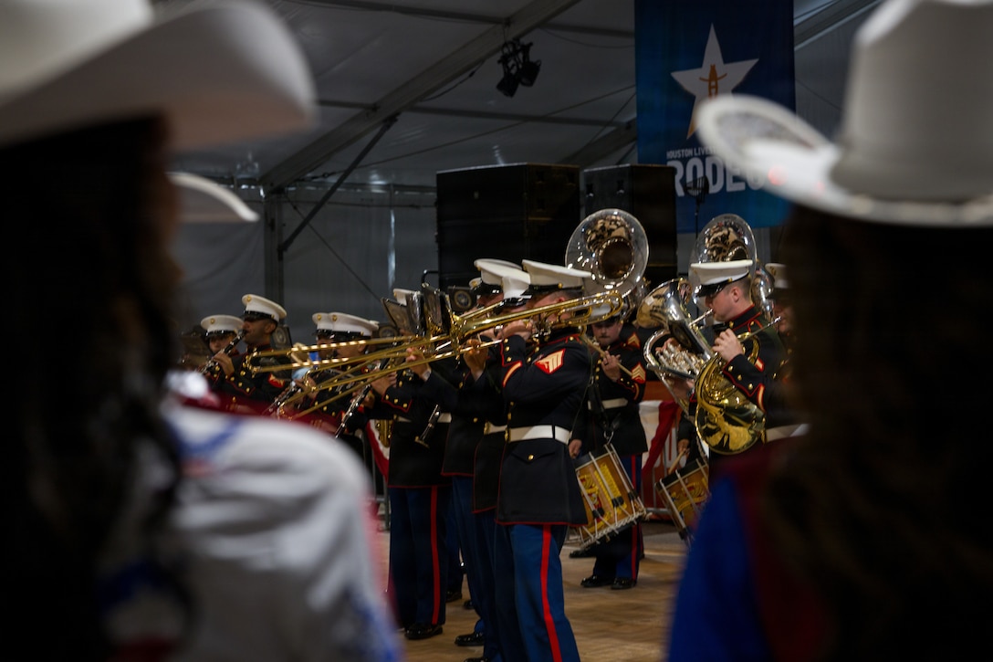 The Marine Forces Reserve Band performs for servicemembers and veterans at the Houston Livestock Show and Rodeo Armed Forces Appreciation Day in Houston, March 4, 2026. Armed Forces Appreciation Day honored nearly 4,000 military personnel and veterans, including a joint service enlistment ceremony for approximately 500 recruits. (U.S. Marine Corps photo by SSgt. Ethan M. LeBlanc)