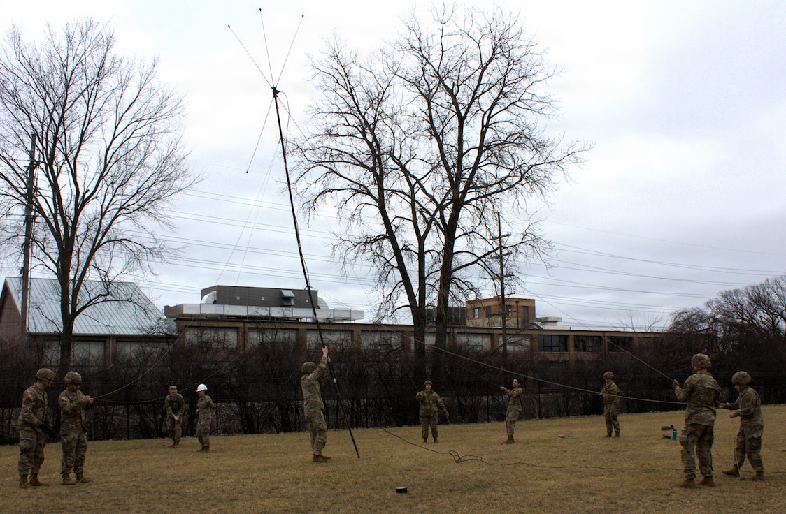 Soldiers of the 708th Medical Company Ground Ambulance lower an antenna at the conclusion of training.