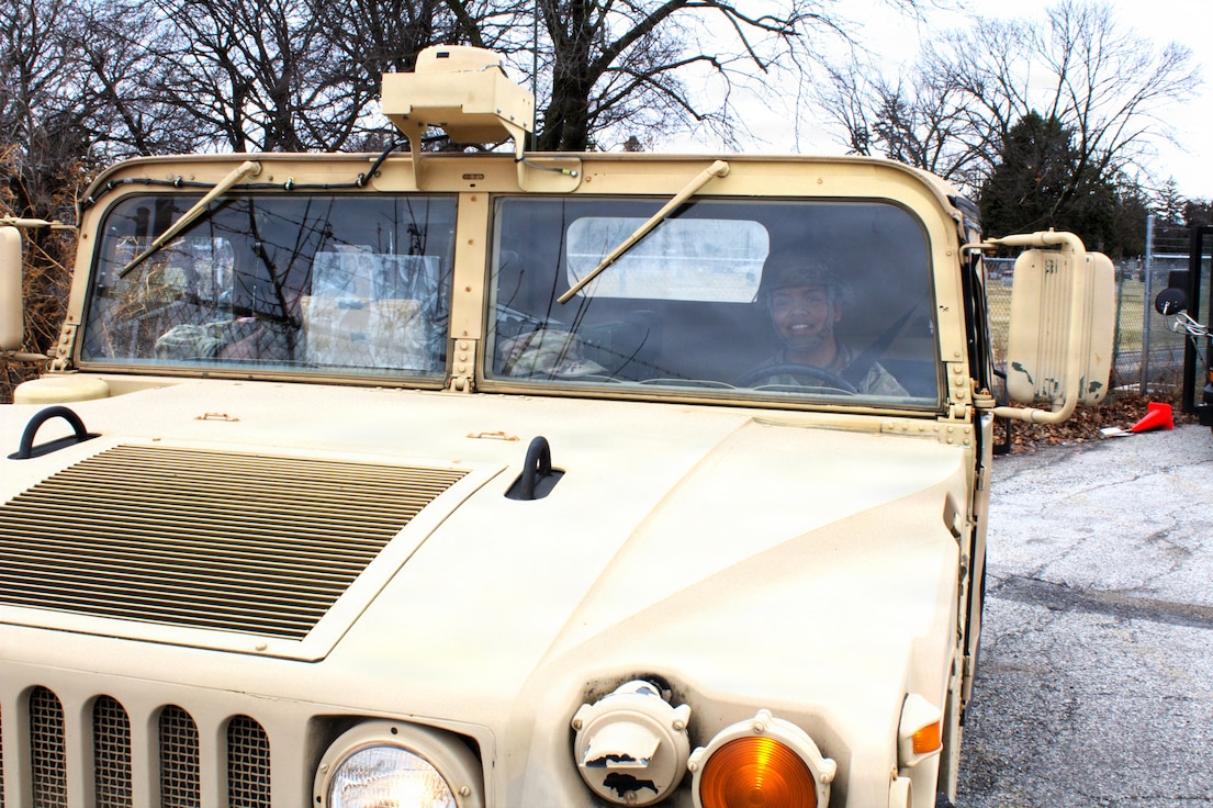 Soldiers with the 108th Multifunctional Medical Battalion drive a High Mobility Multipurpose Wheeled Vehicle as part of the Forest Park St. Patrick's Day parade in Forest Park, Ill.