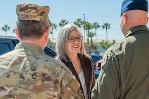 Arizona Governor Katie Hobbs greets U.S. Air Force Brig. Gen. David Berkland, 56th Fighter Wing commander, and Brig. Gen. John Conley, Arizona adjutant general, during an annual Arizona Commanders Summit, March 6, 2026, at Luke Air Force Base, Arizona.