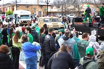 Soldiers with the 108th Multifunctional Medical Battalion drive a High Mobility Multipurpose Wheeled Vehicle as part of the Forest Park St. Patrick's Day parade in Forest Park, Ill.