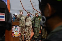 U.S. Army Maj. Gen. William Prendergast, Commander 40th Infantry Division, California Army National Guard, left, Col. Nicholas Parker, Joint Task Force, Washington Army National Guard, Col. Lew Tze Soon, Deputy Chief of Guards, Director Changi Regional Humanitarian Coordination Centre Singapore Armed Forces, salute the formation at the humanitarian assistance and disaster relief demonstration closing ceremony as a part of Exercise Cobra Gold 2026 in Phanom Sarakham District, Chachoengsao, Thailand, Feb. 27, 2026.
