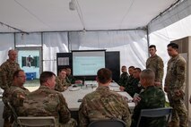 U.S. Army Soldiers conduct a Combined Forces Land Component Commanders Update Brief with Thai and Singaporean service members during Exercise Cobra Gold 2026 at Camp Red Horse, Rayong province, Thailand, March 2, 2026.
