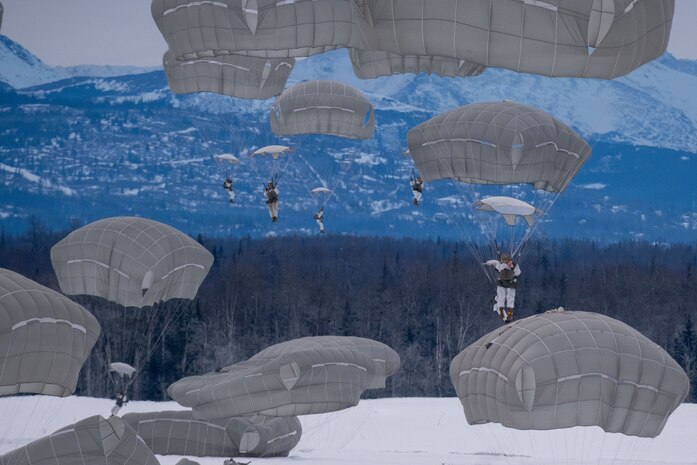 Soldiers assigned to 2nd Infantry Brigade Combat Team (Airborne), 11th Airborne Division and paratroopers assigned to the 3rd Battalion, The Royal Canadian Regiment, prepare to perform a parachute landing fall during a joint airborne exercise over Malemute Drop Zone, near Joint Base Elmendorf-Richardson, Alaska February 7th, 2026.
