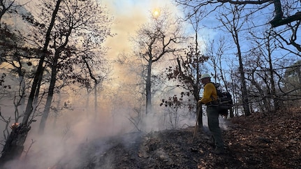 Oklahoma National Guard wildland firefighters conduct fire fighting operations near Talihina, Oklahoma, Feb. 26, 2026. Two eight-Guardsmen crews have been deployed to support the Oklahoma Department of Emergency Management, Oklahoma Department of Agriculture, Oklahoma Department of Public Safety and Oklahoma Forestry Services battle wild fires in the state. The Oklahoma National Guard Wildland Firefighting Program has more than 80 red-card certified Guardsmen trained to support federal, state and local agencies in combating fires. (photo provided by OKNG Wildland Firefighting Program)