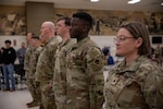 Soldiers assigned to the 145th Mobile Public Affairs Detachment stand at attention during their welcome home ceremony held at the Armed Forces Reserve Center in Mustang, Oklahoma on March 7, 2026. The Soldiers deployed in support of U.S. Special Operations Command Europe, executing over 35 missions that showcased the specialized training of U.S. and allied special operations forces. (Oklahoma National Guard photo by Sgt. Cambrie Cannon)