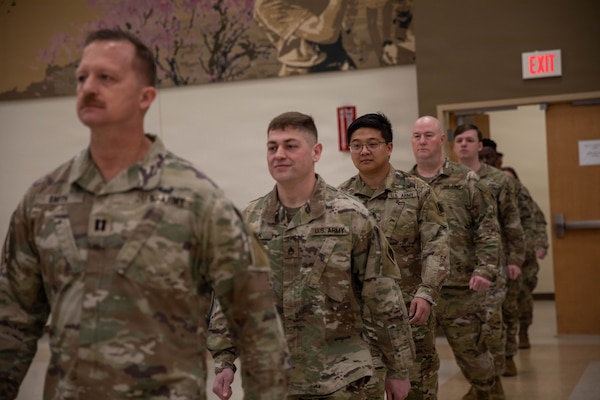 Soldiers assigned to the 145th Mobile Public Affairs Detachment, march into their welcome home ceremony held at the Armed Forces Reserve Center in Mustang, Oklahoma on March 7, 2026. The Soldiers deployed in support of U.S. Special Operations Command Europe, executing over 35 missions that showcased the specialized training of U.S. and allied special operations forces. (Oklahoma National Guard photo by Sgt. Cambrie Cannon)