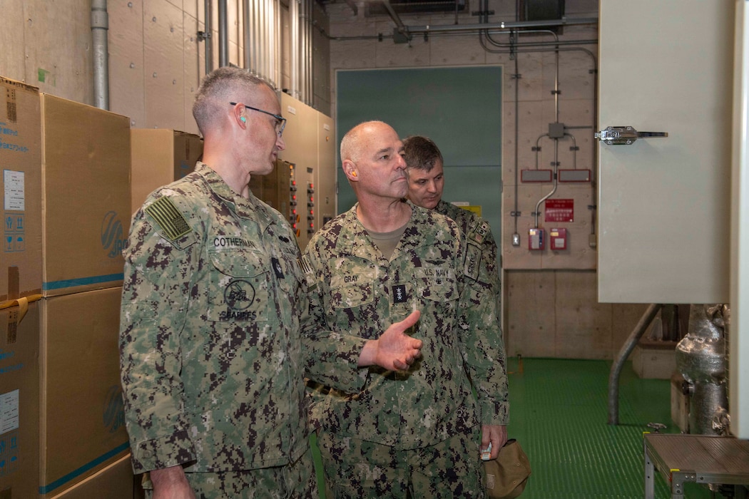 YOKOSUKA, Japan (Jan. 20, 2026) — Cmdr. Andrew Cotherman, public works officer for Commander, Fleet Activities Yokosuka (CFAY), speaks with Vice Adm. Scott Gray, Commander, Navy Installations Command (CNIC), during a tour of CFAY’s public works facilities. Gray’s visit focused on CNIC’s strategic priority to sustain the fleet by
maintaining and modernizing the critical infrastructure that supports global naval
operations. (U.S. Navy photo by Mass Communication Specialist 2nd Class Quinton A.
Lee)