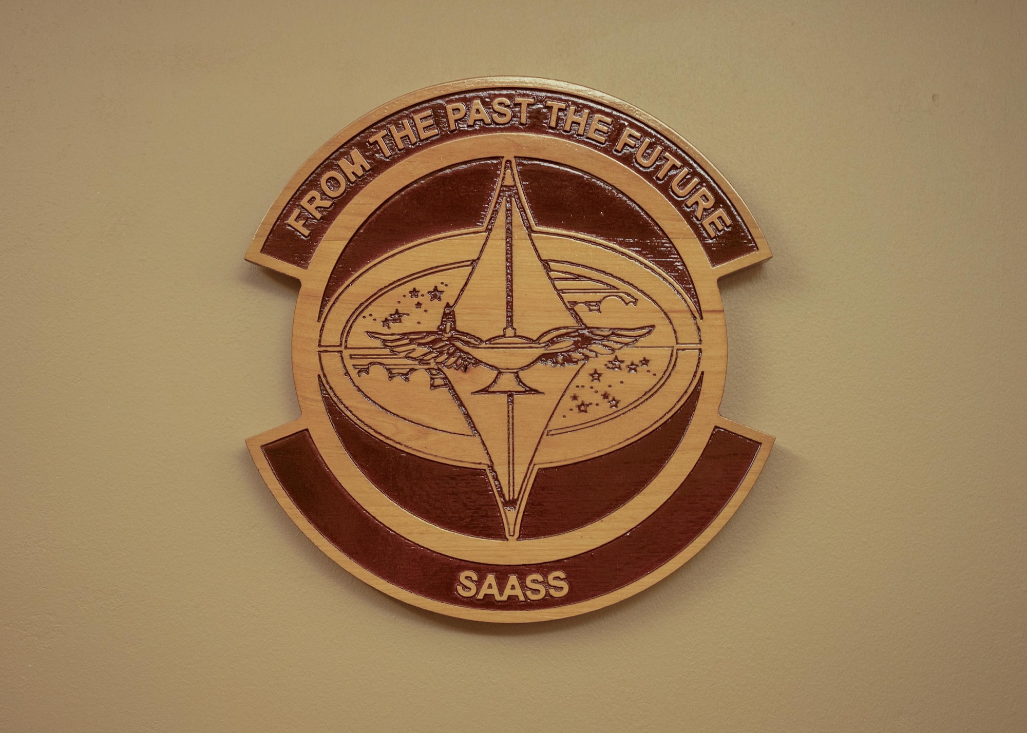 A plaque of the School of Advance Air and Space Studies emblem at Maxwell Air Force Base, Alabama March 2, 2026.