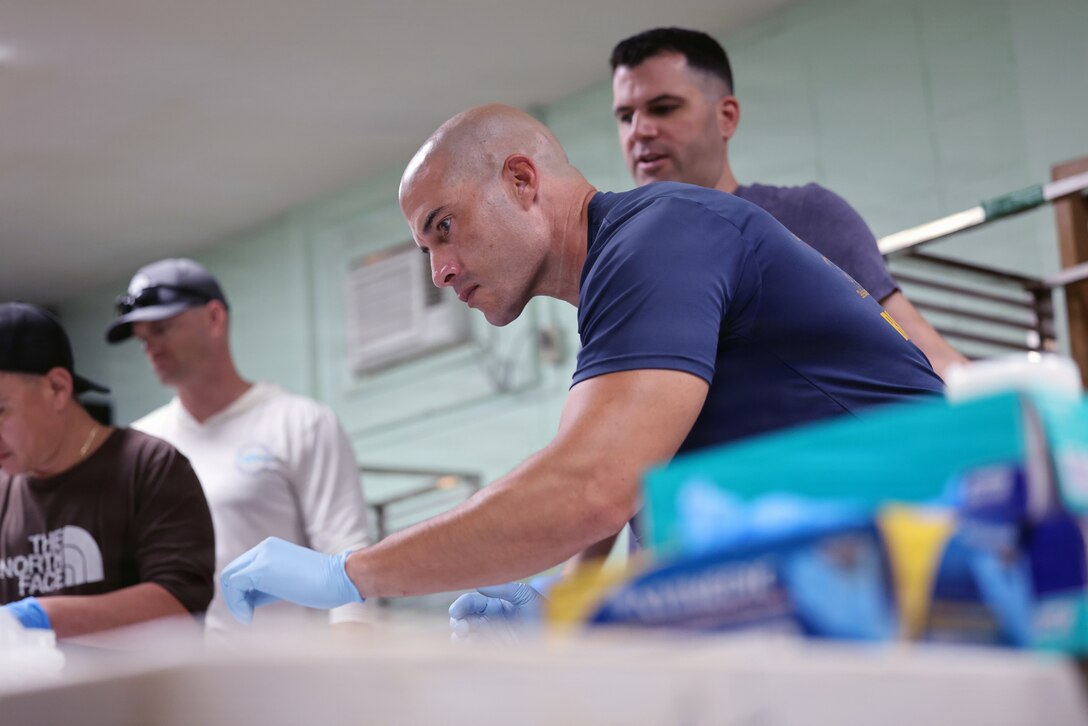 U.S. Army Sgt. 1st Class Nicholas Hernandez, Defense POW/MA Accounting Agency team sergeant, sorts an Unknown's remains during a DPAA disinterment operation at the Manila American Cemetery and Memorial in the Philippines in preparation to repatriate them to the Daniel K. Inouye DPAA Center of Excellence, Joint Base Pearl Harbor-Hickam, Hawaii, for analysis and potential identification, March 4, 2026.