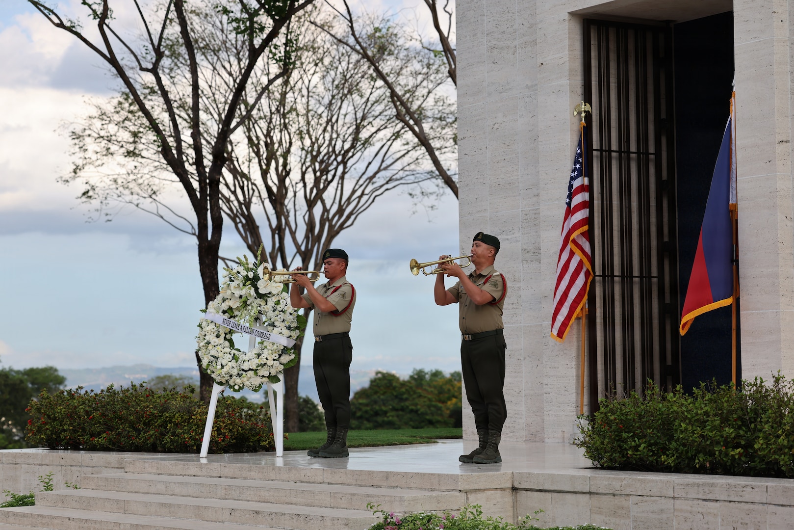 Two members of the Republic of the Philippines army play Taps during the first-ever Repatriation Ceremony held at the Manila American Cemetery and Memorial in the Philippines for U.S. personnel who were disinterred there, March 6, 2026.