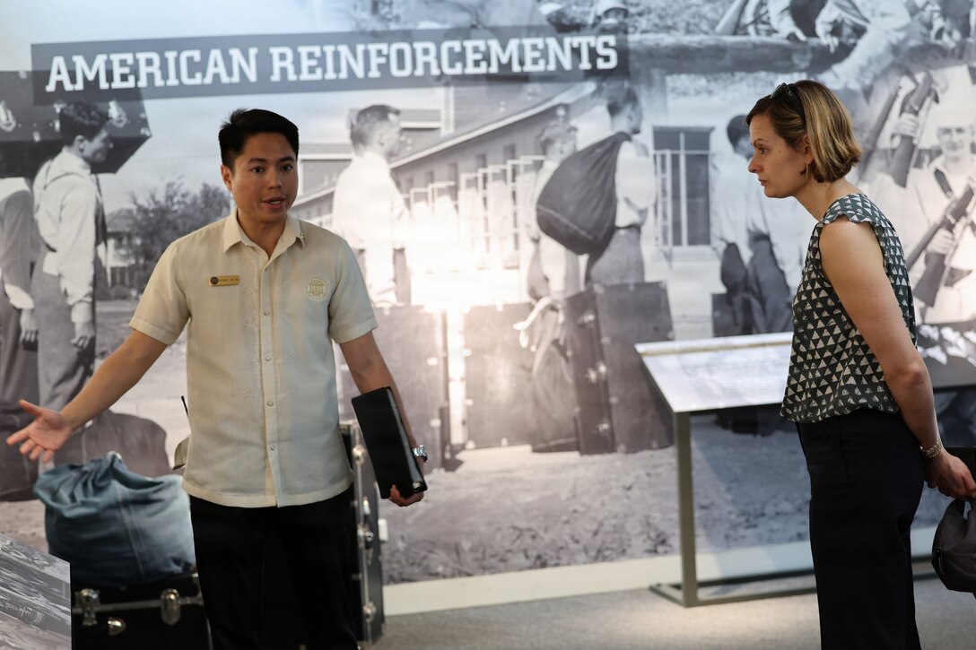 Vicente Lim IV, Manila American Cemetery and Memorial staff member, provides a tour of the cemetery’s museum to U.S. Navy Capt. Meghan Bodnar, Defense POW/MIA Accounting Agency deputy director for operations, and other DPAA staff members prior to the first Repatriation Ceremony held at the cemetery for U.S. personnel who were disinterred there, March 6, 2026.
