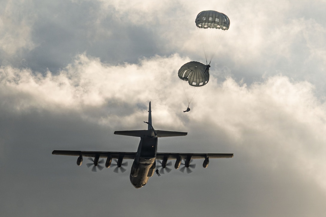 U.S. Marines with 3rd Landing Support Battalion, 3rd Marine Logistics Group, along with U.S. Army Rangers with 75th Ranger Regiment deploy from an KC-130J Super Hercules aircraft with Marine Aerial Refueler Transport Squadron 152, Marine Aircraft Group 12 during a simulated raid on Ie Shima, Okinawa, Japan, Feb. 19, 2026.