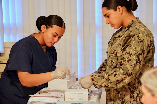 Hospital Corpsman 3rd Class Melissa Avila Cruz, left, and Hospitalman Apprentice Gabriela Avecillas participate in a Forensic Healthcare Program training course at Navy Medicine Readiness and Training Command Twentynine Palms on Nov. 18, 2025. The training prepares hospital corpsmen to assist providers during sensitive medical examinations while ensuring proper evidence handling and patient care, supporting force readiness. (U.S. Navy photo by Christopher Jones, NMRTC / Naval Hospital Twentynine Palms public affairs officer)