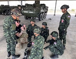 Sgt. 1st Class Samuel Mattern, 205th Regimental Training Institute, Washington Army National Guard discusses the rigging techniques of the Winch (Self) Recovery method with soldiers from the Royal Thai Army during a Stryker Leader Exchange on Feb. 2, 2026, in Chon Buri Province, Thailand. Courtesy photo.