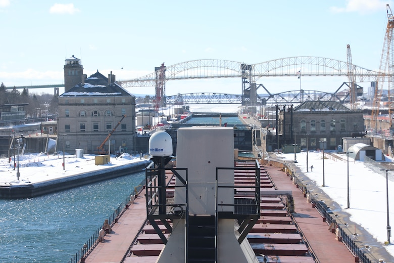The tug/barge Clyde S. VanEnkevort/Erie Trader waits to make its way into the Poe Lock at the Soo Locks in Sault Ste. Marie, Mich. on March 14, 2025 for the opening of the Soo Locks.
The red deck of the tug/barge is seen in the foreground as the Poe Lock is in the background. The photo is taken from the rear pilot house and the perspective makes it look like the ship will not make it into the lock.