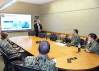 JOINT BASE SAN ANTONIO-FORT SAM HOUSTON – (March 4, 2026) – Dr. Darrin Frye, chief science director, Naval Medical Research Unit (NAMRU) San Antonio, briefs one of the core capabilities within the unit to Capt. Kris Hodapp, deputy Corps Chief, Medical Service Corps (MSC) and Capt. Bryan Pyle, MSC Policy and Practice officer, during a visit to NAMRU San Antonio at the Battlefield Health and Trauma Research Institute (BHT). During the visit, Hodapp and Pyle toured research laboratories at BHT and the Tri-Service Research Laboratory and conducted independent record reviews with MSC officers. Additionally, they gave a State of the MSC briefing with emphasis on Navy Medicine’s North Star and Lines of Effort. Other areas of briefing included career progression, community values, manpower, promotion trends, and maintaining accuracy of military records. The MSC mission is to provide specialized healthcare, administrative, and scientific support to Naval forces, maximizing operational readiness and optimizing the "human weapon system". Comprised of professionals in clinical, scientific, and administrative fields, the MSC supports Navy Medicine’s mission to deliver manned, trained, and equipped medical units to the Fleet, Fleet Marine Force, and Joint Forces. NAMRU San Antonio, part of Navy Medicine Research & Development, conducts gap-driven combat casualty care, craniofacial, and directed energy research in support of Navy, Marine Corps and joint U.S. warfighter health readiness and lethality while engaged in routine and expeditionary operations. (Navy Photo by Burrell Parmer, NAMRU San Antonio Public Affairs/Released)