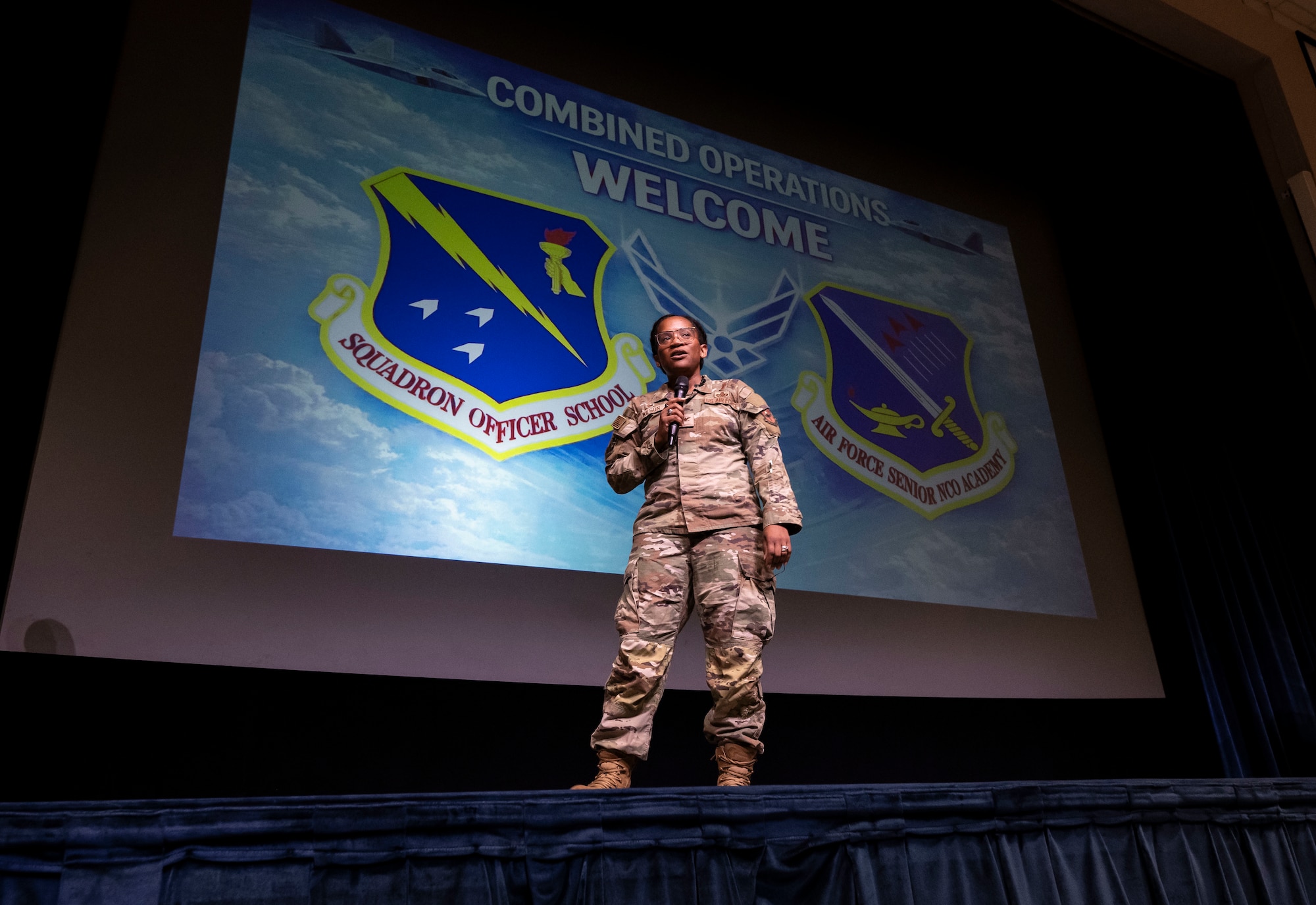 U.S. Air Force Col. Stephanie Q. Wilson, Thomas N. Barnes Center for Enlisted Education commander, addresses students from Squadron Officer School and the Senior Noncommissioned Officer Academy during a combined operations welcome at Maxwell Air Force Base, Alabama, March 5, 2026. (U.S. Air Force photo by Brian Ferguson)
