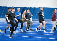 Airmen exercise together.