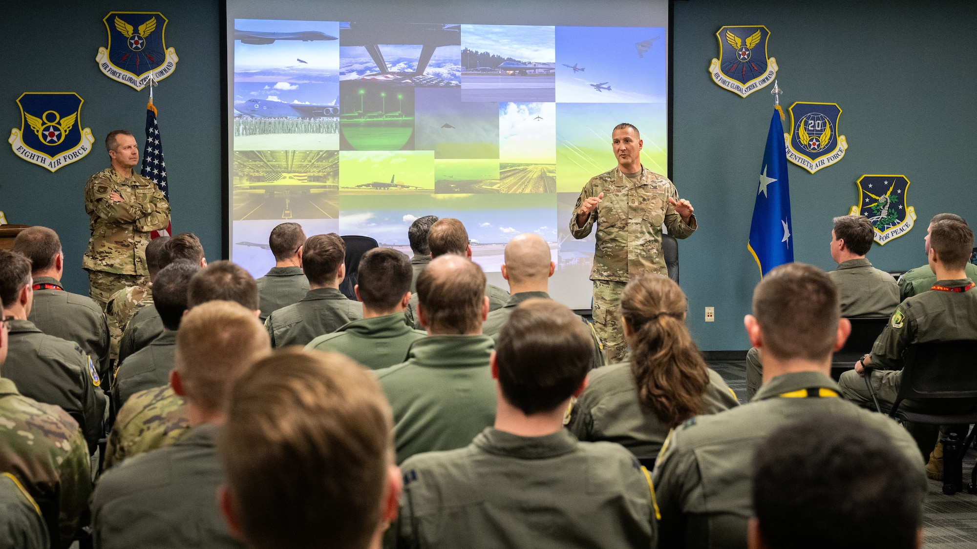 Chief Master Sgt. Brandon Wolfgang speaks to a room of Airmen.