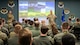 Chief Master Sgt. Brandon Wolfgang speaks to a room of Airmen.