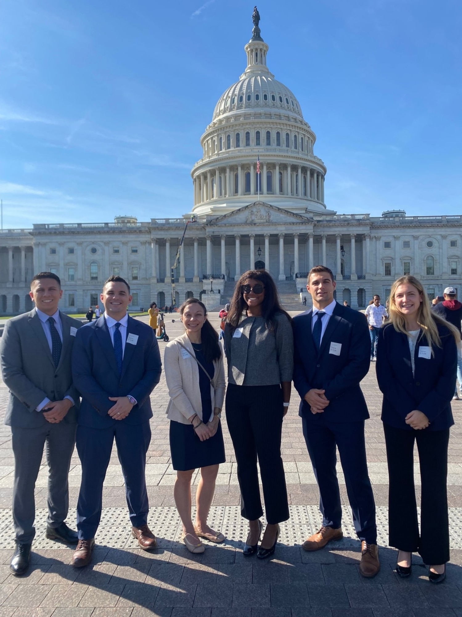 Galaxy cohort 12 members (left to right) Capt. Jake Mendoza, Maj. Bryce Leiter (then Capt.), Ms. Kristin Burk, 1st Lt Sabrina Taylor, Capt. Greg Skage and 1st Leigha Woelffer, are pictured in front of the U.S. Capitol Building during the travel portion of the Galaxy Program in 2024. The Galaxy Program is a Space Systems Command (SSC) junior force rapid professional-development program that provides a fast, flexible, rapid capability delivery experience for early career Space Force acquirers. (Courtesy photo from SSC Galaxy Program).
