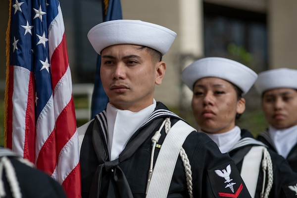 U.S. Navy Hospital Corpsman Third Class Nelson Abong, member of the color guard, stands at attention during a change of charge ceremony at Navy Medicine Readiness and Training Command San Diego, March 9. NMRTC San Diego supports Navy and Marine Corps readiness by ensuring its medical forces are ready to deploy and provide medical support, ashore or at sea. (U.S. Navy photo by Mass Communication Specialist Seaman Jason Afable)