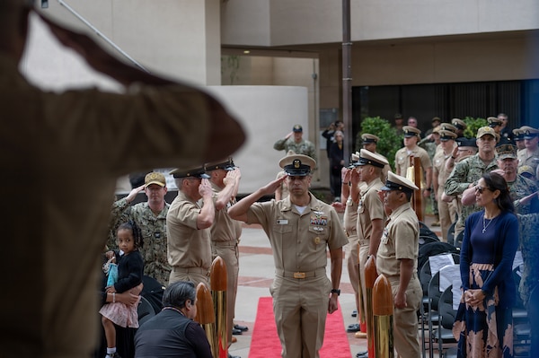 U.S. Navy Command Master Chief Petty Officer Adolfo Gonzalez, outgoing Navy Medicine Readiness and Training Command San Diego Command Master Chief, salutes during a change of charge ceremony at Naval Medical Center San Diego, March 9. NMRTC San Diego supports Navy and Marine Corps readiness by ensuring its medical forces are ready to deploy and provide medical support, ashore or at sea. (U.S. Navy photo by Mass Communication Specialist Seaman Jason Afable)