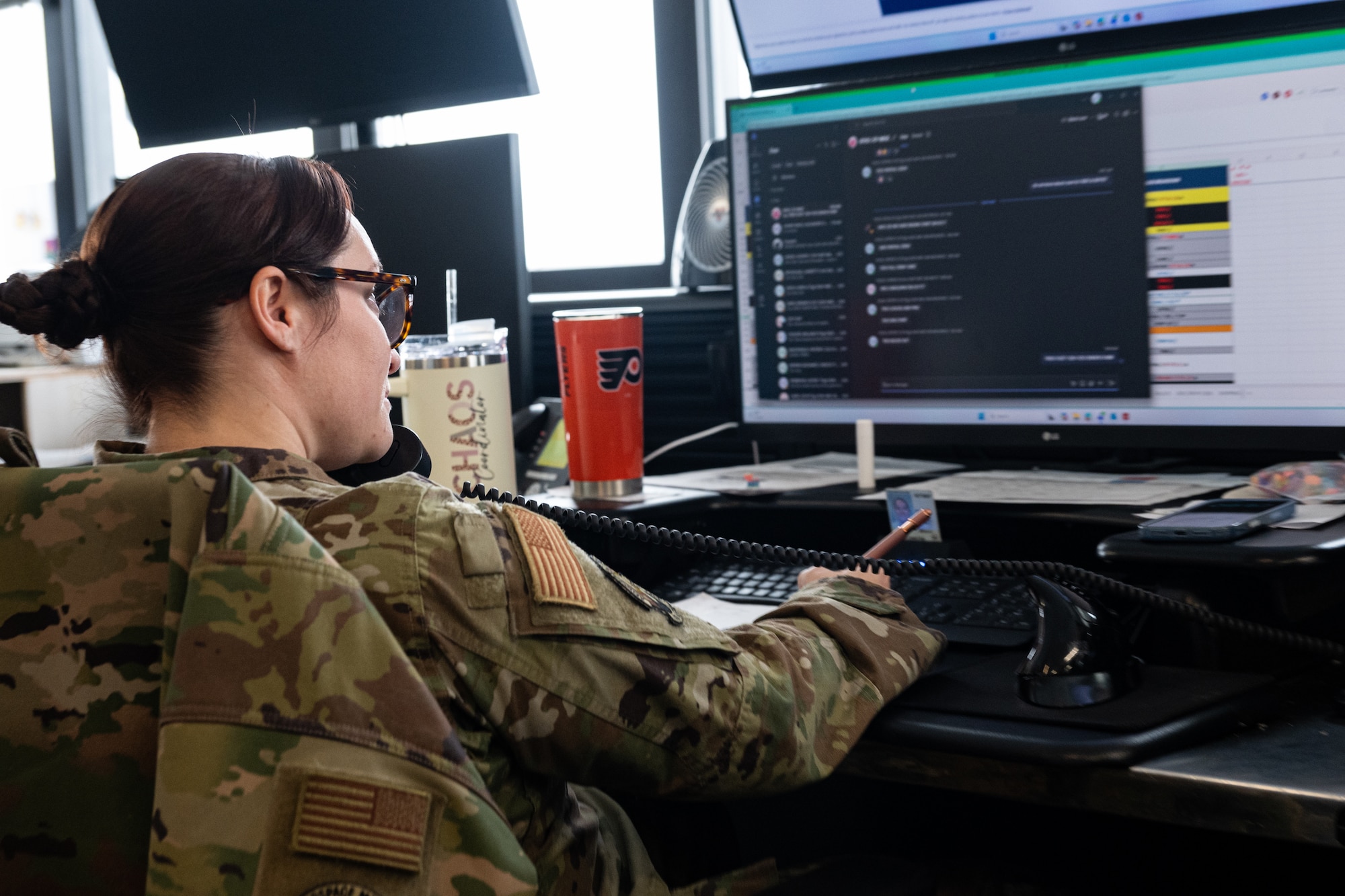 U.S. Air Force Tech Sgt. Alyssa Conklin, 436th Aerial Port Squadron air terminal operations center information controller, coordinates cargo operations on Dover Air Force Base, Delaware, Feb. 26, 2026. Airmen track documentation, manage cargo data and communicate with aircrews and ground teams to ensure the timely and accurate movement of personnel and equipment. (U.S. Air Force photo by Airman 1st Class Macy Dismore-Mann)