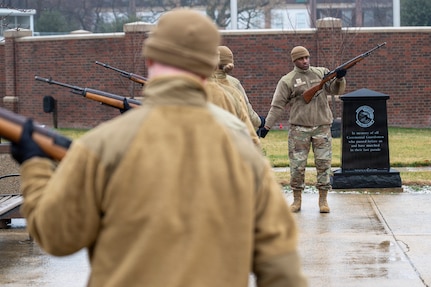 U.S. Air Force Airman 1st Class Terrance Patrick, right, a ceremonial guardsman with the U.S. Air Force Honor Guard Firing Party, demonstrates drill cadence and movement timing during training on Joint Base Anacostia-Bolling, Washington, D.C., March 3, 2026. The Firing Party trained on memorial honors, with one element of those honors the firing of three rifle volleys during funeral services at Arlington National Cemetery. (U.S. Air Force photo by Hayden Hallman)