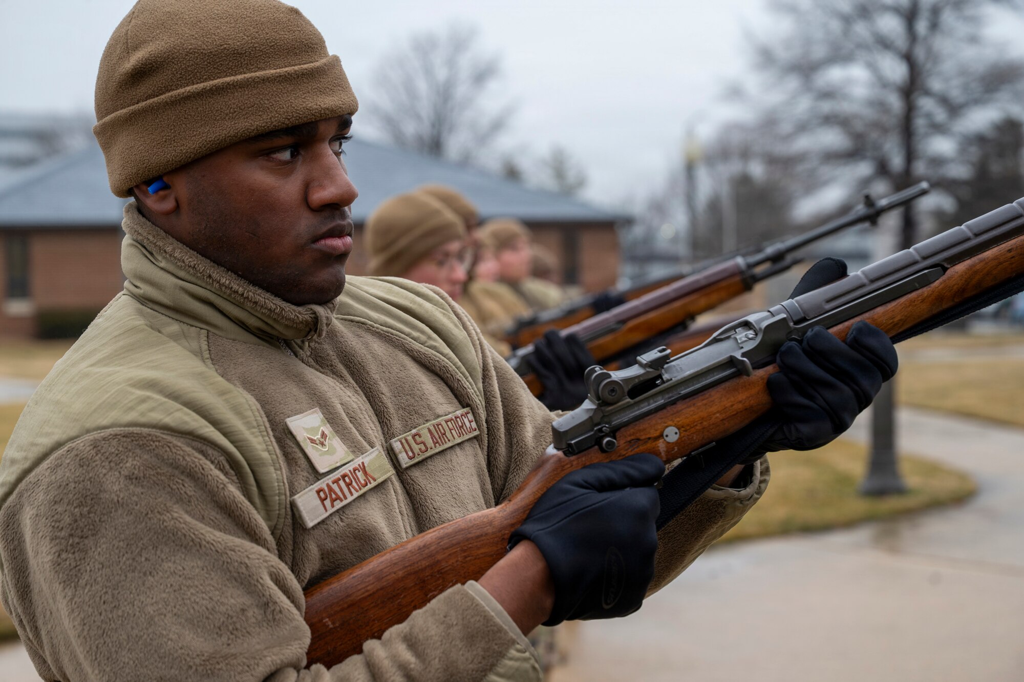 U.S. Air Force Airman 1st Class Terrance Patrick, a ceremonial guardsman with the U.S. Air Force Honor Guard Firing Party, fires a three-round volley during training on Joint Base Anacostia-Bolling, Washington, D.C., March 3, 2026. Historically, three volleys of rifle fire indicated that casualties had been cared for in a combat environment and that the fighting could resume. These volleys became an official military custom that survives to this day. (U.S. Air Force photo by Hayden Hallman)