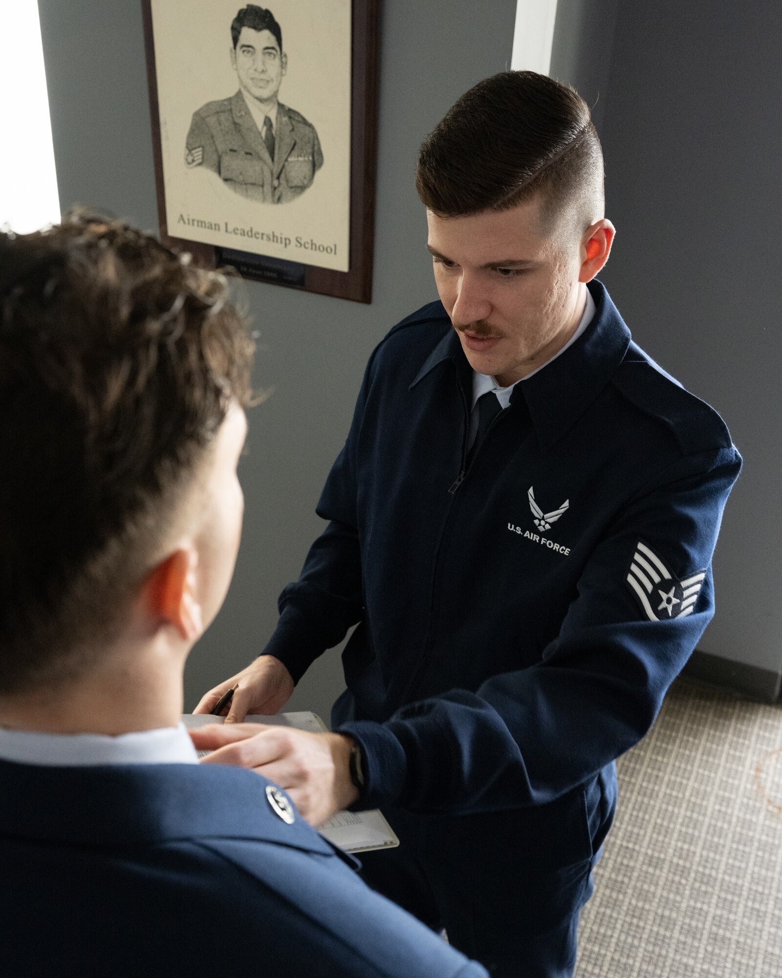 U.S. Air Force Staff Sgt. Kaden Ballentine, 436th Force Support Squadron Airman Leadership School instructor, conducts a uniform inspection on the first day of class at Dover Air Force Base, Delaware, March 2, 2026. The students must prepare for inspections in various uniforms throughout the five week course. (U.S. Air Force photo by Mauricio Campino)
