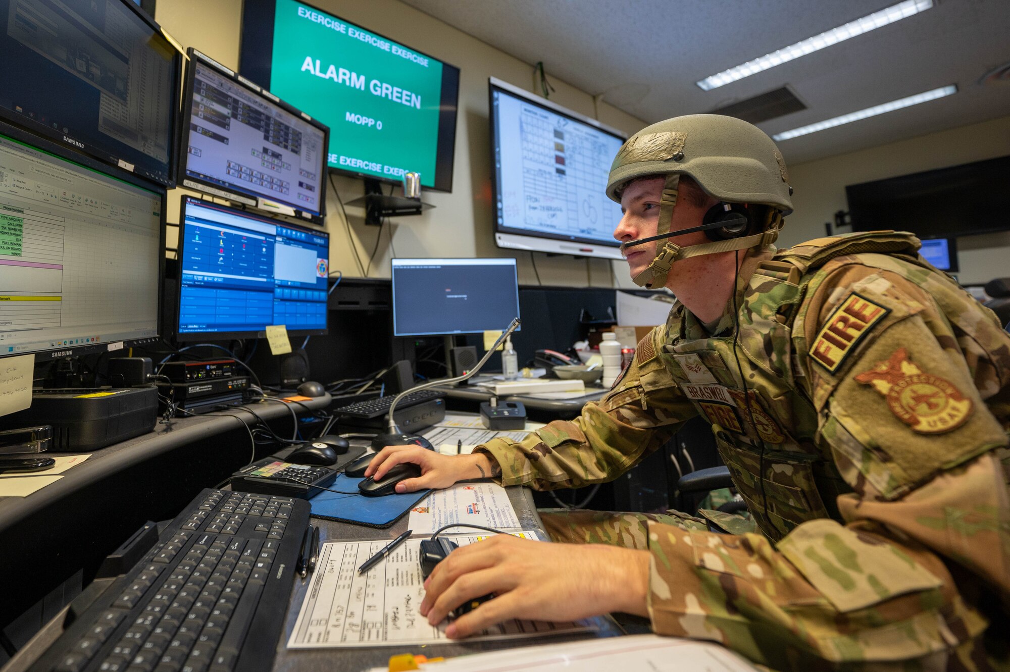 U.S. Air Force Senior Airman Michael Braswell, 18th Civil Engineer Squadron firefighter protection specialist, dispatches calls during U.S. Air Force-led operational exercise Beverly Midnight 26 at Kadena Air Base, Japan, Mar. 10, 2026. BM26 enhances U.S. interoperability by fostering an exchange of information and refining shared tactics, techniques and procedures to better integrate defense capabilities in support of regional security. (U.S. Air Force photo by Airman 1st Class Francisco Huerta)