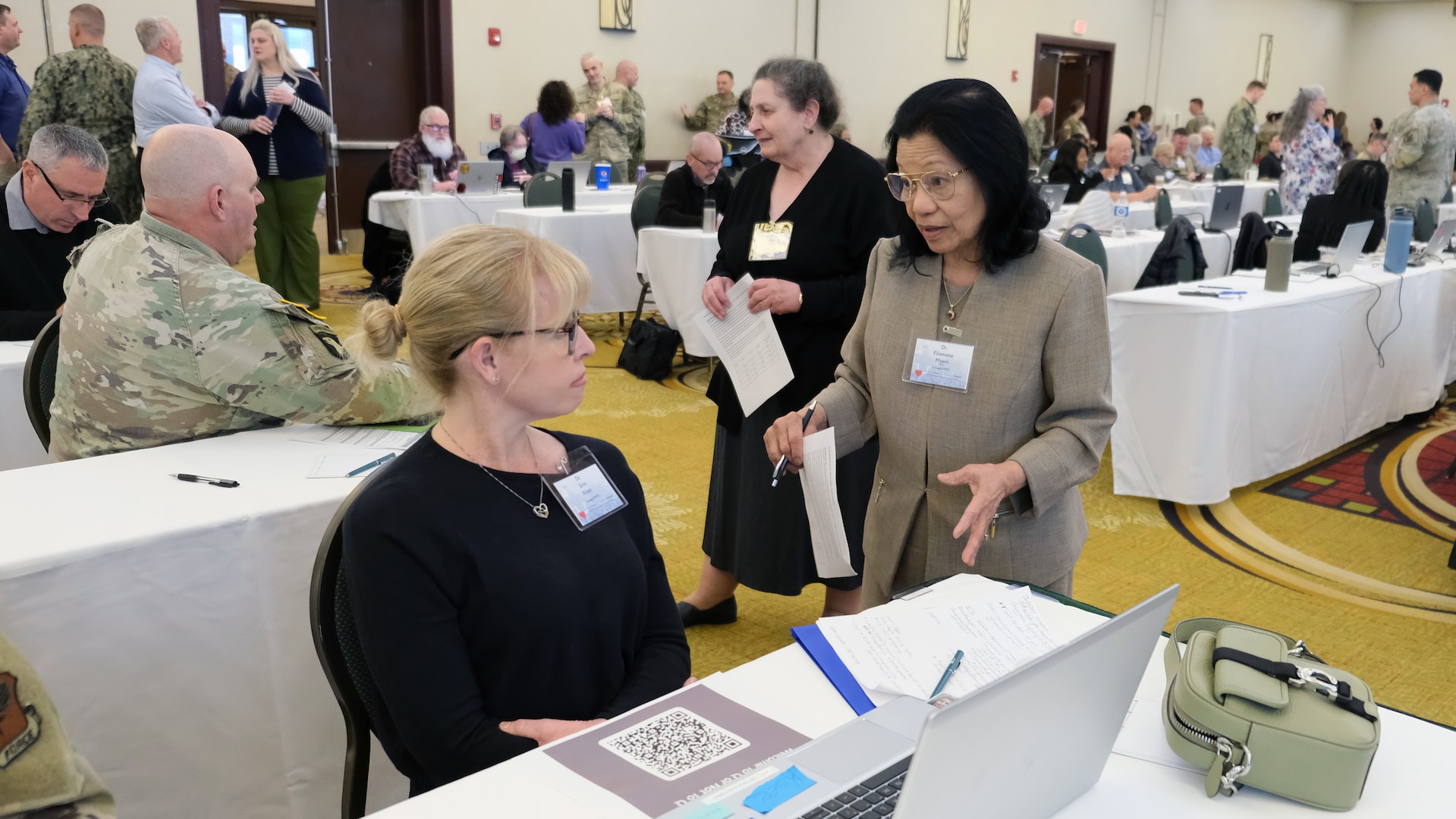 Attendees of the 2026 USMEPCOM Medical Leadership Training Symposium (MLTS) network collaborate during a break. The USMEPCOM MLTS, held March 9-11, brought medical leaders together to strengthen collaboration, share best practices and advance standardization efforts supporting the accession of the next generation of service members.