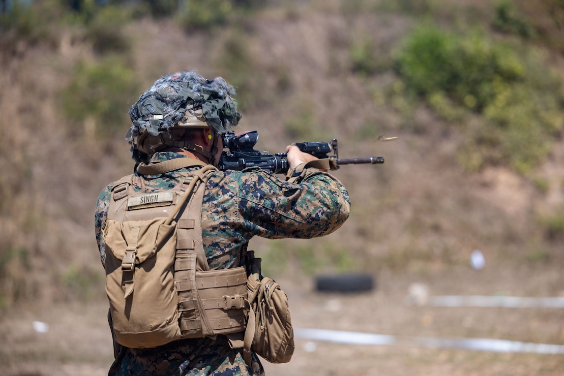 U.S. Marine Corps Lance Cpl. Tajinder Singh, an amphibious combat vehicle crewmember assigned to Task Force Ashland, I Marine Expeditionary Force, fires a M4 carbine during table five of the combat marksmanship program as part of Exercise Cobra Gold 26 at Sattahip Naval Base Chonburi Province, Thailand, March 1, 2026.