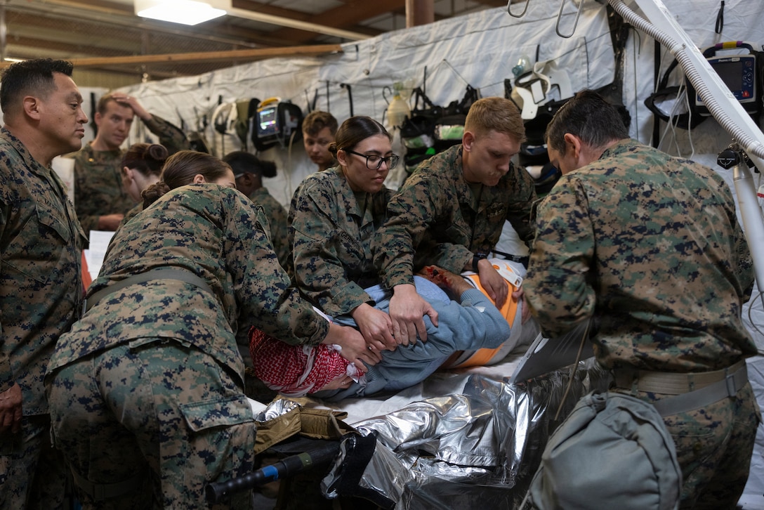 U.S. Navy Hospital Corpsmen with 1st Medical Battalion, 1st Marine Logistics Group, apply a back brace to a simulated casualty during a Certification Exercise on Marine Corps Base Camp Pendleton, California, March 4, 2026.