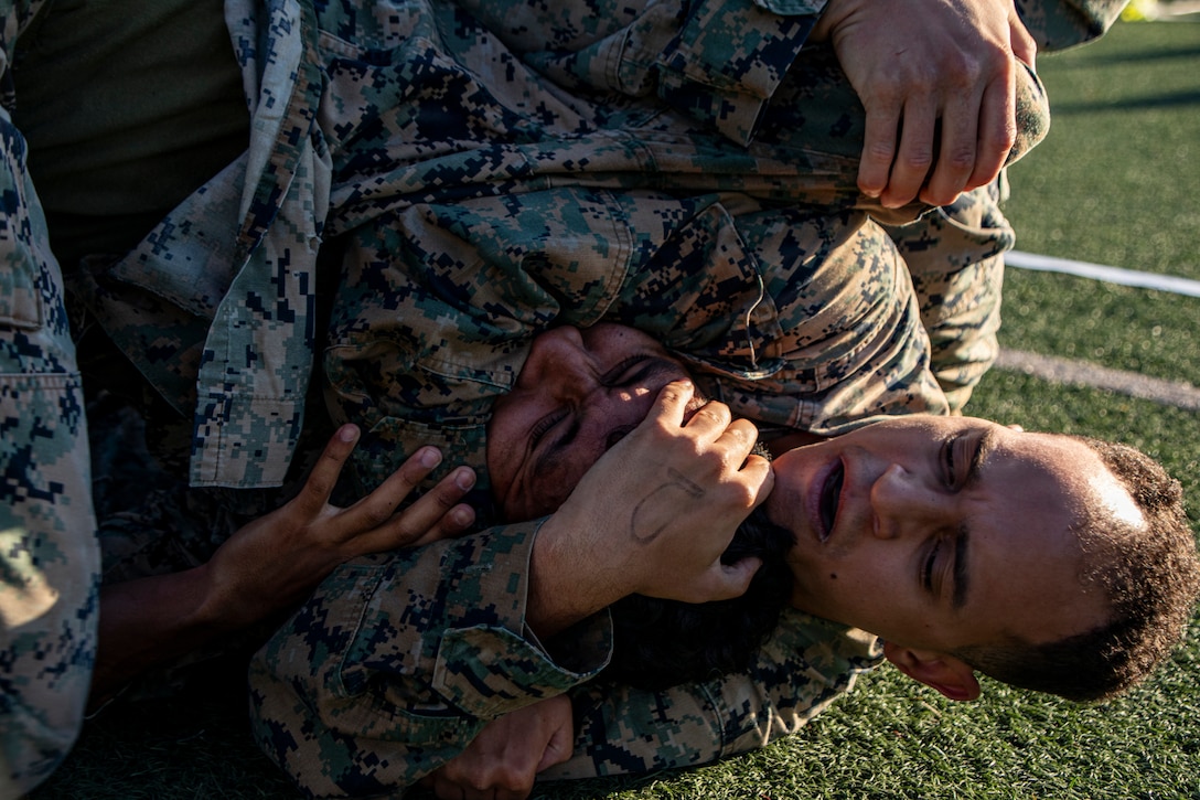 U.S. Marines with Marine Wing Communications Squadron 38, Marine Air Control Group 38, 3rd Marine Aircraft Wing, ground fight during a Marine Corps Martial Arts Program competition at Marine Corps Air Station Miramar, California, March 6, 2026.