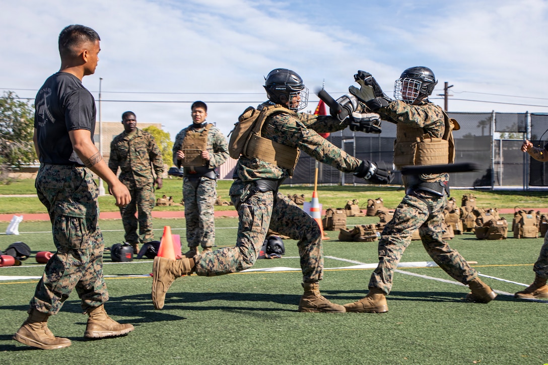 A U.S. Marine with Marine Wing Communications Squadron 38, Marine Air Control Group 38, 3rd Marine Aircraft Wing, performs weapons techniques during a Marine Corps Martial Arts Program competition at Marine Corps Air Station Miramar, California, March 6, 2026.