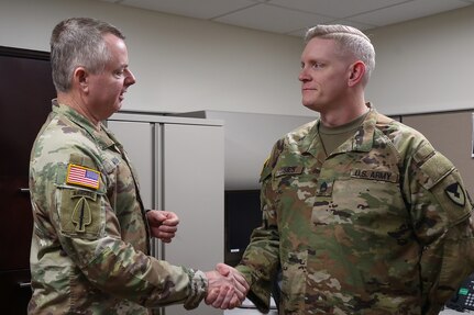 Lt. Gen. Christopher O. Mohan, U.S. Army Materiel Command commanding general, left, presents a coin to Sgt. 1st Class Nathan L. James, 45th Finance Center internal control advisor, at Fort Knox, Ky., March 4, 2026. In his role, James is responsible for evaluating and strengthening financial management controls to support regulatory compliance, audit readiness and fiscal accountability in the U.S. Central Command and Continental United States areas of responsibility. (U.S. Army photo by Pvt. 1st Class Arpita Singh)
