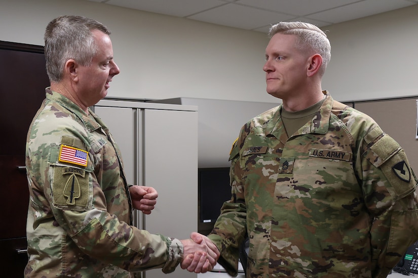 Lt. Gen. Christopher O. Mohan, U.S. Army Materiel Command commanding general, left, presents a coin to Sgt. 1st Class Nathan L. James, 45th Finance Center internal control advisor, at Fort Knox, Ky., March 4, 2026. In his role, James is responsible for evaluating and strengthening financial management controls to support regulatory compliance, audit readiness and fiscal accountability in the U.S. Central Command and Continental United States areas of responsibility. (U.S. Army photo by Pvt. 1st Class Arpita Singh)