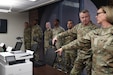 Col. Michelle M. Williams, U.S. Army Financial Management Command commander, right, briefs Lt. Gen. Christopher O. Mohan, U.S. Army Materiel Command commanding general, center right, on the Financial Management Tactical Platform as 45th Finance Soldiers listen at Fort Knox, Ky., March 4, 2026. Mohan visited with USAFMCOM’s command team, Soldiers and civilian employees during an AMC major subordinate command update. (U.S. Army photo by Pvt. 1st Class Arpita Singh)