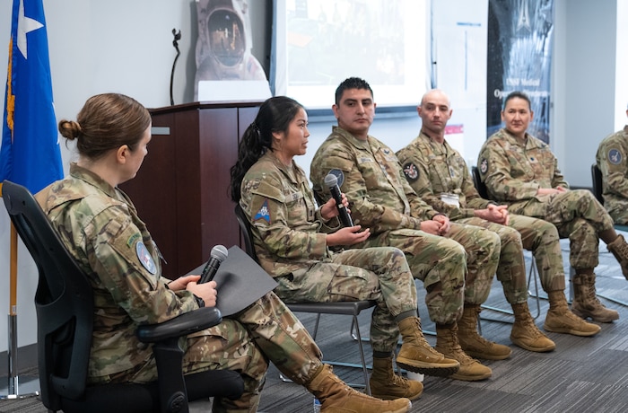 Image of Airmen and Guardians talking on a panel.