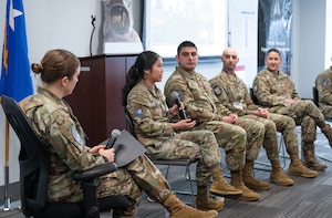 Image of Airmen and Guardians talking on a panel.
