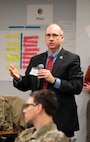 Image of a civilian talking to a crowd.