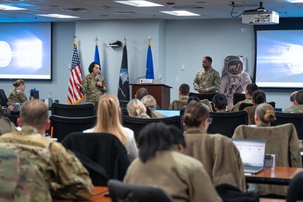 Image of Airmen and Guardians talking to a crowd.