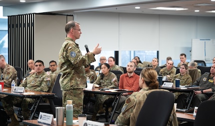 Image of a Guardian talking to a crowd.